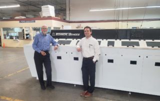 Doug and Ken standing by TDC machine